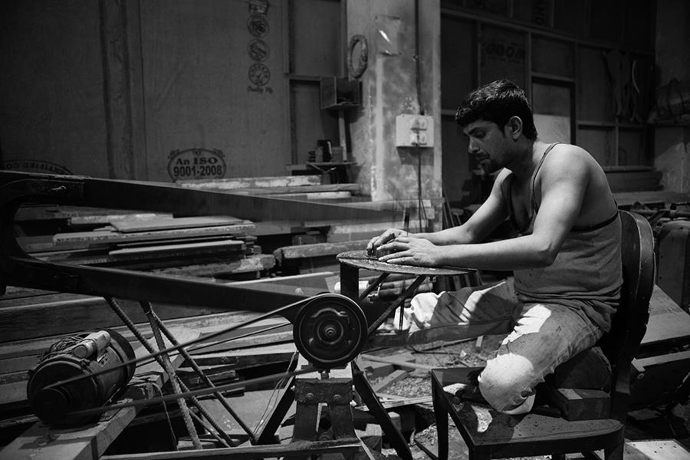 Artisan working on a furniture detail in the workshop